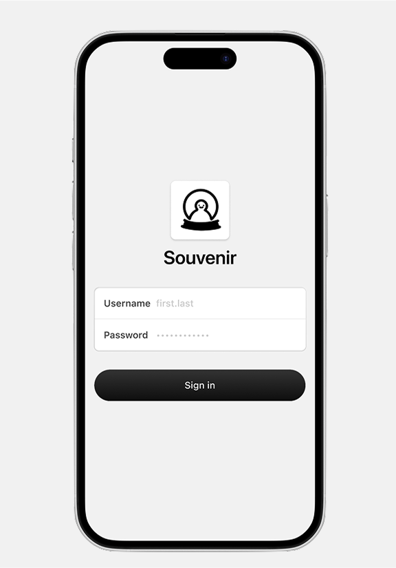 A phone showing the login page of Souvenir